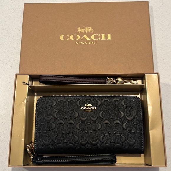 Coach Handbags - Coach long zip around wallet NIB